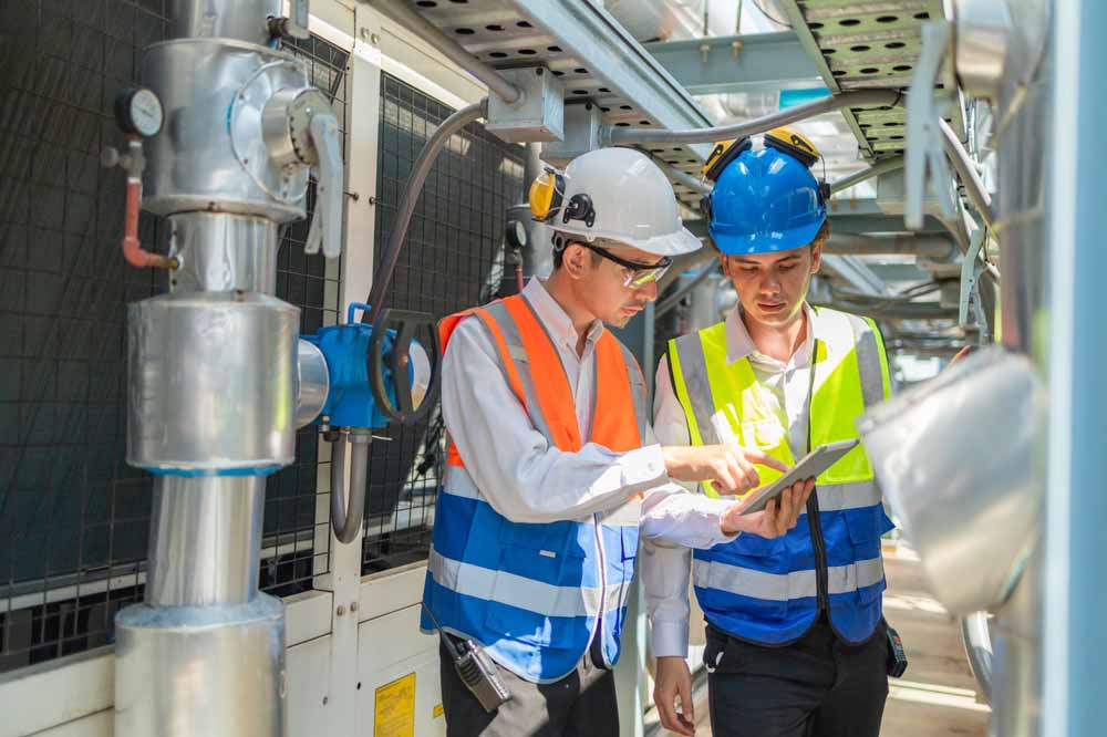 Engineer inspects water heater pump system Jupiter, FL